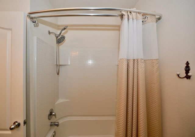 bathroom featuring shower / tub combo with curtain