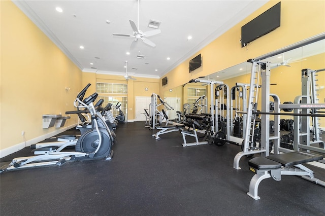 workout area with ceiling fan and ornamental molding