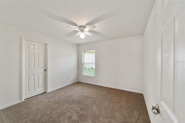 unfurnished room with carpet floors and ceiling fan