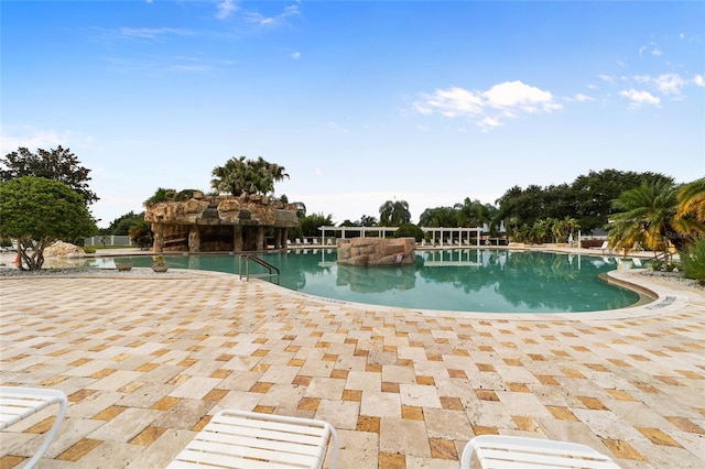 view of swimming pool featuring a patio area