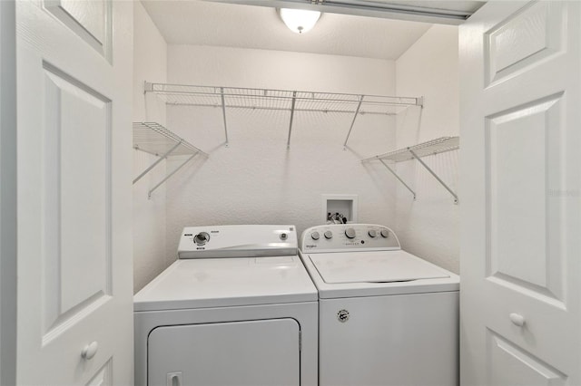 laundry area featuring washing machine and dryer