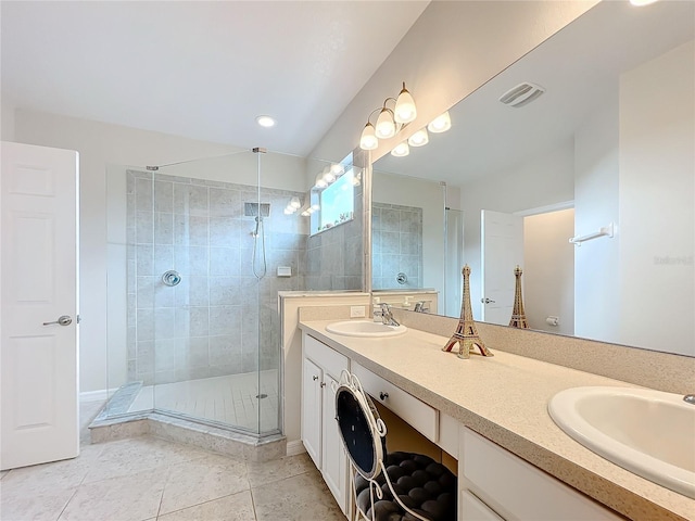 bathroom with walk in shower, tile flooring, and dual bowl vanity