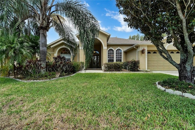 view of front of house featuring a front lawn and a garage