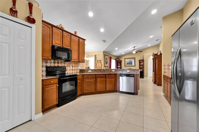 kitchen featuring backsplash, black appliances, vaulted ceiling, ceiling fan, and kitchen peninsula