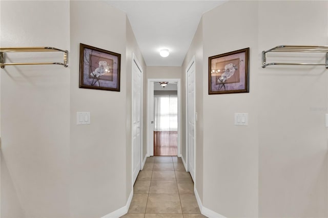 hallway with light tile patterned floors