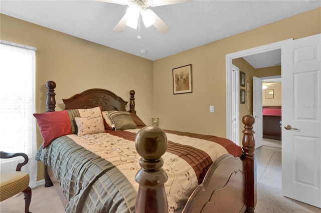 bedroom with light tile patterned floors and ceiling fan