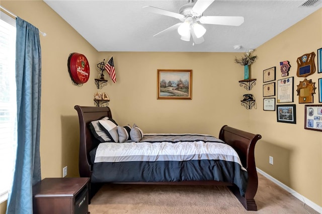 carpeted bedroom featuring ceiling fan