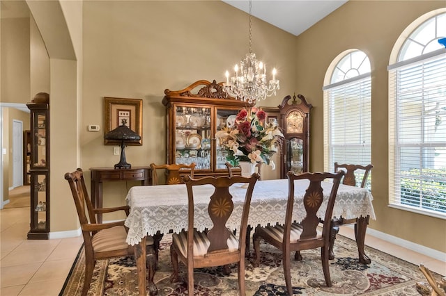 dining room with a notable chandelier and light tile patterned floors