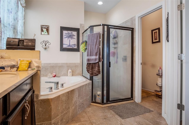 bathroom featuring separate shower and tub, tile patterned floors, and vanity