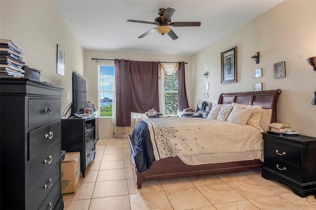 bedroom with ceiling fan and light tile patterned floors