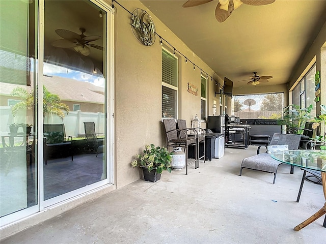 view of patio / terrace featuring ceiling fan