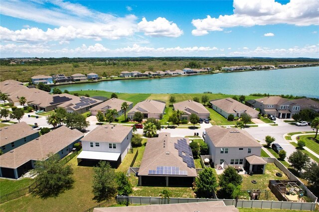 bird's eye view with a water view and a residential view