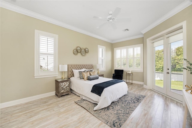 bedroom featuring ceiling fan, access to exterior, light wood-type flooring, and multiple windows