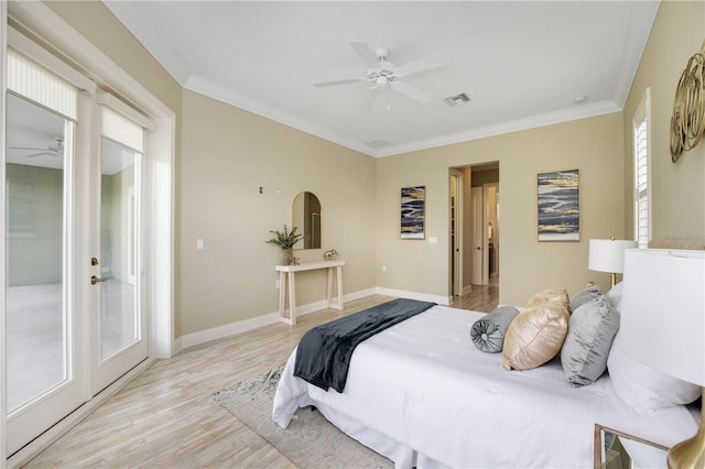 bedroom featuring french doors, light wood-type flooring, ornamental molding, access to outside, and ceiling fan