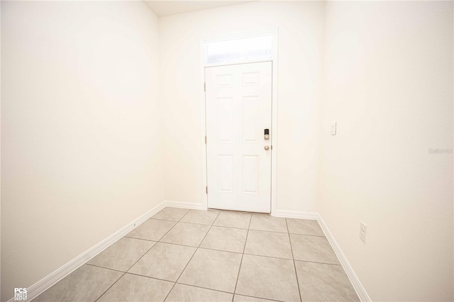 entryway with light tile patterned floors