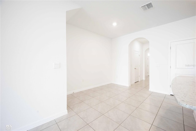 unfurnished room featuring light tile patterned floors