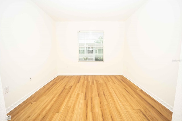 unfurnished room with light wood-type flooring