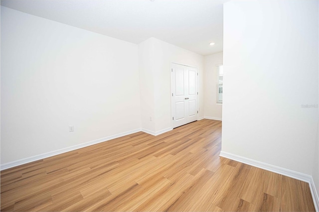 unfurnished room featuring light hardwood / wood-style floors