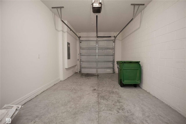 garage featuring electric panel and a garage door opener