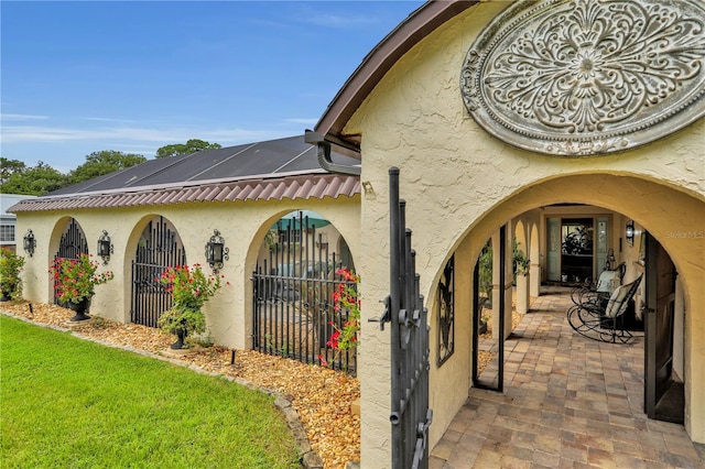 view of side of property with a patio area