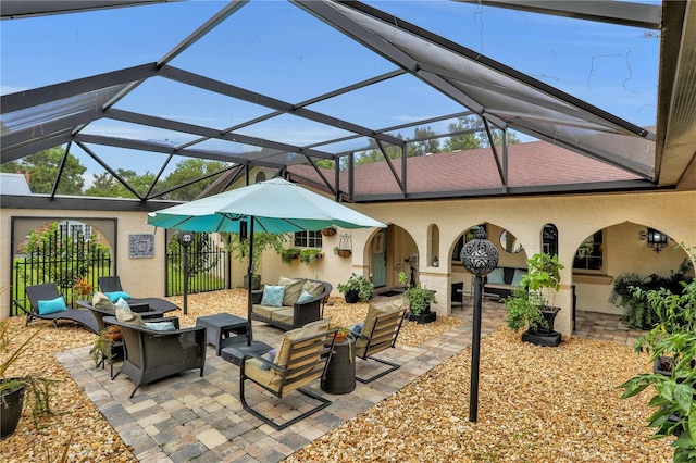 view of patio featuring outdoor lounge area and a lanai