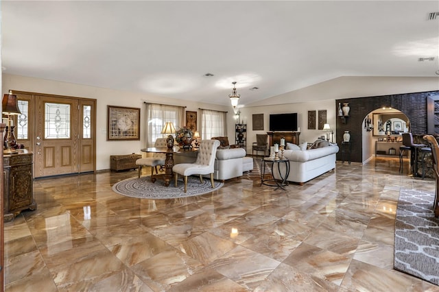 living room featuring vaulted ceiling