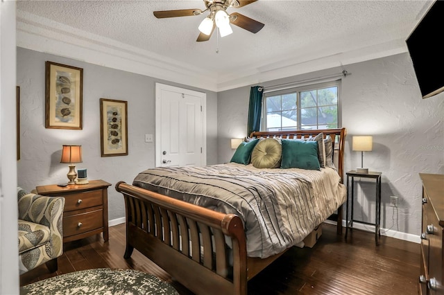 bedroom featuring a textured ceiling, ceiling fan, a closet, and dark hardwood / wood-style floors