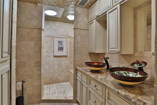 bathroom featuring vanity and tasteful backsplash