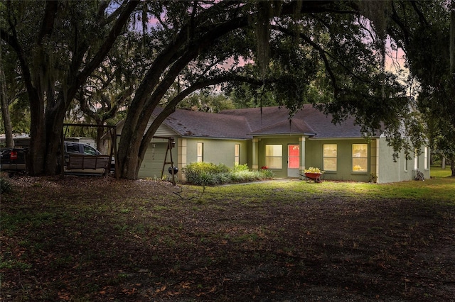 single story home featuring a garage