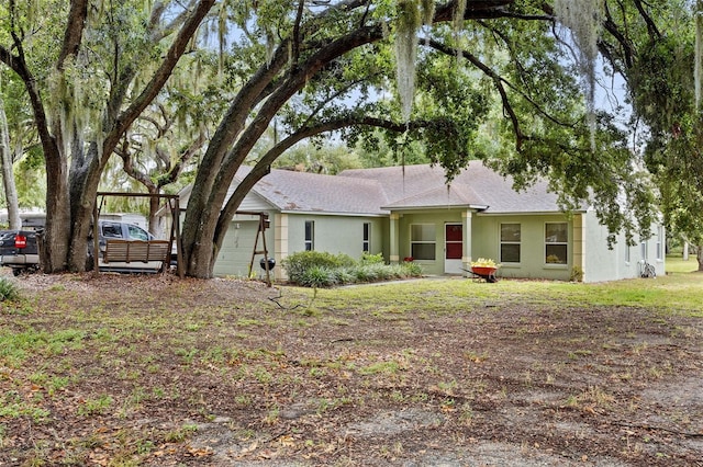 ranch-style house featuring a garage