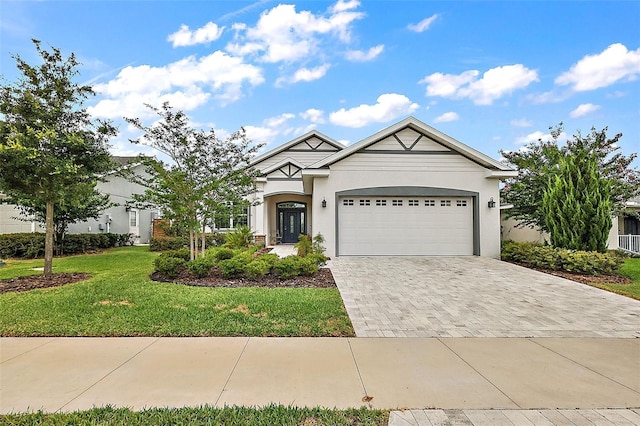 view of front of property featuring a garage and a front yard