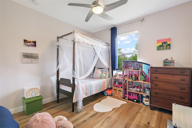 bedroom featuring hardwood / wood-style flooring and ceiling fan