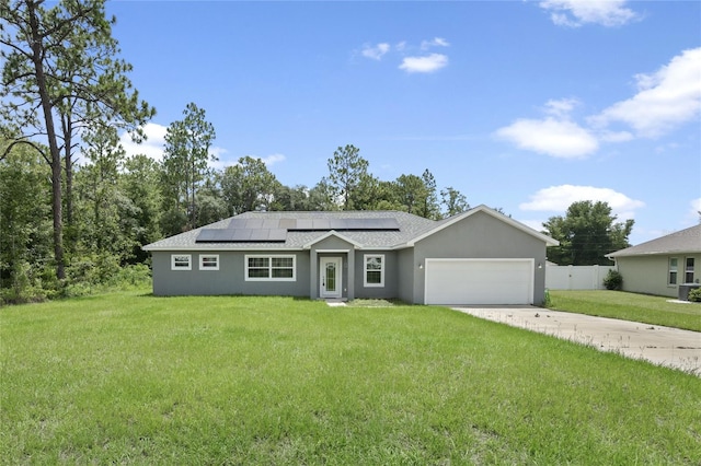 single story home featuring a front yard, a garage, and solar panels