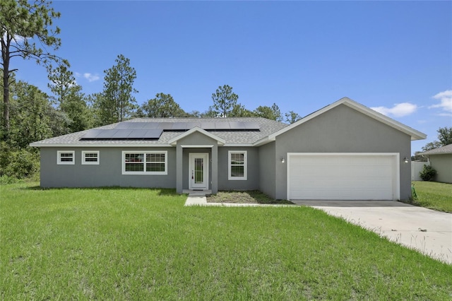 ranch-style house featuring a garage, a front lawn, and solar panels