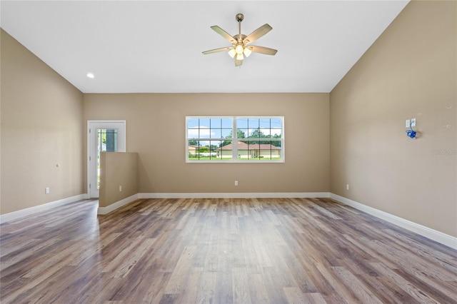 unfurnished room with hardwood / wood-style floors, ceiling fan, and a wealth of natural light