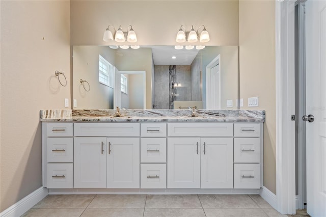 bathroom with tile patterned floors and double sink vanity