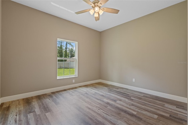 unfurnished room featuring wood-type flooring and ceiling fan