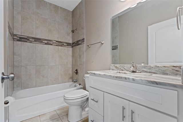 full bathroom with toilet, tile patterned floors, tiled shower / bath combo, and vanity