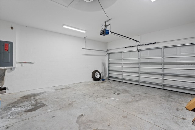 garage featuring a garage door opener and electric panel