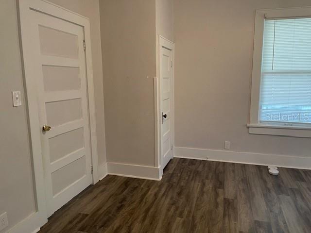 interior space with dark wood-type flooring