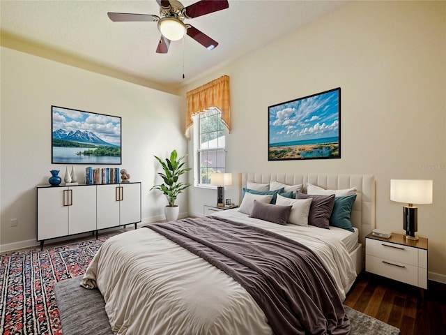 bedroom with ceiling fan and dark hardwood / wood-style floors