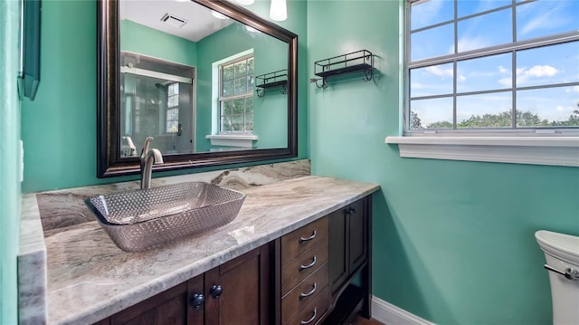 bathroom with vanity and toilet