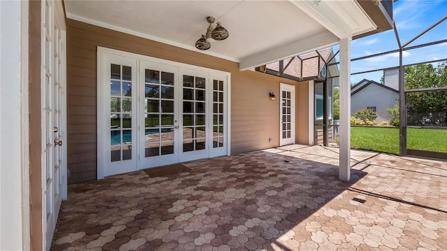 unfurnished sunroom with french doors