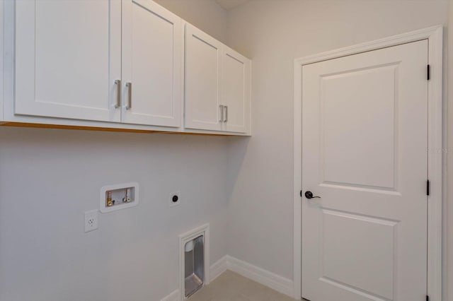 laundry room with cabinets, washer hookup, and electric dryer hookup