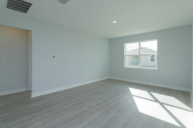 unfurnished room featuring light hardwood / wood-style flooring