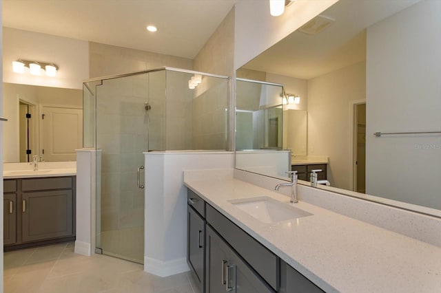 bathroom featuring tile patterned floors, vanity, and an enclosed shower