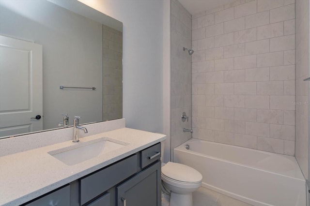 full bathroom with vanity, toilet, and tiled shower / bath