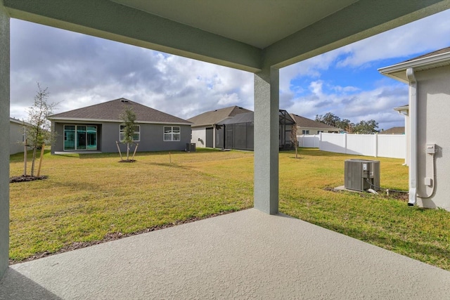 view of yard featuring cooling unit and a patio area