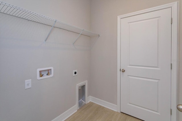 laundry area with hookup for a washing machine, light wood-type flooring, and hookup for an electric dryer