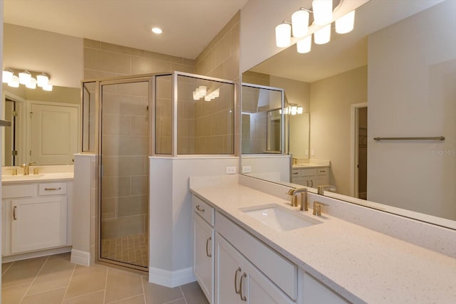 bathroom with vanity, tile patterned floors, and a shower with shower door